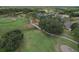 Beautiful aerial view of a golf course community with homes nestled among trees and winding paths at 3350 Stonebridge Trl, Valrico, FL 33596