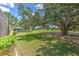 Beautiful backyard with a screened lanai, mature trees and view to the golf course at 3350 Stonebridge Trl, Valrico, FL 33596