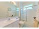 Bright bathroom with a shower and tub combination and updated vanity with solid surface countertops at 3350 Stonebridge Trl, Valrico, FL 33596