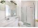 Bathroom features white vanity, framed mirror, toilet, and glass shower at 3350 Stonebridge Trl, Valrico, FL 33596