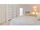 Bright bedroom with built-in shelving, plush carpet, and television at 3350 Stonebridge Trl, Valrico, FL 33596