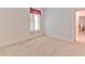 Clean bedroom featuring carpet, neutral walls, and natural light through the window at 3350 Stonebridge Trl, Valrico, FL 33596