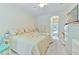 Bright bedroom featuring neutral carpet, closet, and ensuite bathroom at 3350 Stonebridge Trl, Valrico, FL 33596