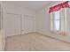 Neat bedroom featuring a closet and window providing natural light at 3350 Stonebridge Trl, Valrico, FL 33596