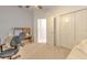 Cozy carpeted bedroom featuring an open doorway and double door closet with ample space at 3350 Stonebridge Trl, Valrico, FL 33596