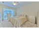 Spacious bedroom boasting plush carpet, ceiling fan, and sliding glass doors to the lanai at 3350 Stonebridge Trl, Valrico, FL 33596