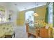 Bright dining area with tile flooring, tropical wallpaper, and direct access to the living room and kitchen at 3350 Stonebridge Trl, Valrico, FL 33596