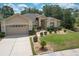 Charming single-story home featuring a meticulously landscaped front yard and a two-car garage at 3350 Stonebridge Trl, Valrico, FL 33596