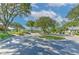 Golf carts parked near the club, amidst mature trees and landscaping, ready for a leisurely round of golf at 3350 Stonebridge Trl, Valrico, FL 33596
