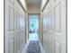 Hallway with tile flooring leading into bathroom at 3350 Stonebridge Trl, Valrico, FL 33596