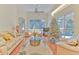 Bright living room with hardwood floors, a large window, and sliding glass doors to the pool area at 3350 Stonebridge Trl, Valrico, FL 33596