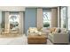 Bright living room showcasing a comfortable seating area, large windows, and natural light at 3444 Lapis Lake Dr, Zephyrhills, FL 33541