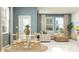 Inviting living space with dining area leading into a comfortable living room with neutral decor at 3444 Lapis Lake Dr, Zephyrhills, FL 33541