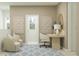 Bright office space with a functional desk, laptop, geometric decor, and comfortable chairs at 3444 Lapis Lake Dr, Zephyrhills, FL 33541