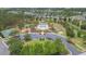 Aerial view of community with pool, basketball court, park, pond, and single-Gathering homes at 34447 Blue Ash Ct, Wesley Chapel, FL 33545