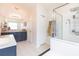 Spacious bathroom with double vanities, a walk-in shower and separate toilet room at 34447 Blue Ash Ct, Wesley Chapel, FL 33545