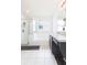 Bright bathroom featuring a shower, soaking tub, and vanity with ample counter space at 34447 Blue Ash Ct, Wesley Chapel, FL 33545
