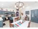 Open kitchen with stainless steel appliances, breakfast bar, and dining area at 34447 Blue Ash Ct, Wesley Chapel, FL 33545