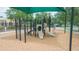 Community playground with slides, climbing frames, and a wood chip ground cover at 34447 Blue Ash Ct, Wesley Chapel, FL 33545