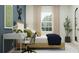 Bedroom featuring a study desk, plants, neutral accents, and outdoor views at 3465 Lapis Lake Dr, Zephyrhills, FL 33541