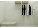 Organized closet features ample hanging space and shelf, perfect for maximizing storage and convenience at 3465 Lapis Lake Dr, Zephyrhills, FL 33541