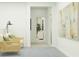 Inviting hallway with neutral tones, artwork, and stylish furnishings provides access to other rooms at 3465 Lapis Lake Dr, Zephyrhills, FL 33541