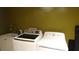 Functional laundry room equipped with a washer, dryer, and utility sink at 3914 Roswell Pl, Land O Lakes, FL 34639