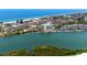 Gorgeous aerial view of the waterfront condos with marina and beach, offering a serene coastal living experience at 399 2Nd St # 217, Indian Rocks Beach, FL 33785