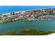 Gorgeous aerial view of the waterfront condos with marina and beach, offering a serene coastal living experience at 399 2Nd St # 217, Indian Rocks Beach, FL 33785