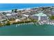 Beautiful waterfront condo building with private boat docks and beach access, showcasing the perfect coastal lifestyle at 399 2Nd St # 217, Indian Rocks Beach, FL 33785
