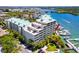 Scenic aerial shot of the building showcasing the pool, marina, and beautiful waterfront setting at 399 2Nd St # 217, Indian Rocks Beach, FL 33785