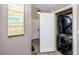 Conveniently located laundry closet in the hallway with stackable washer and dryer at 399 2Nd St # 217, Indian Rocks Beach, FL 33785