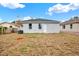 Backyard view of home with small tree at 4071 45Th N Ave, St Petersburg, FL 33714