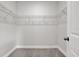 Walk-in closet featuring wire shelving, neutral walls, carpeted floor, and white trim at 4071 45Th N Ave, St Petersburg, FL 33714
