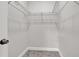 Walk-in closet featuring wire shelving, neutral walls, carpeted floor, and white trim at 4071 45Th N Ave, St Petersburg, FL 33714