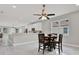 Open dining room space with a modern light fixture and tiled flooring at 4071 45Th N Ave, St Petersburg, FL 33714