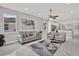 Bright living room with neutral paint, tiled floor, modern furnishings and ample natural light at 4071 45Th N Ave, St Petersburg, FL 33714