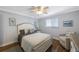 Bedroom with light wood flooring, neutral decor, and a ceiling fan at 4103 Gulf Blvd # 107, St Pete Beach, FL 33706