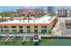 Waterfront condo features a private boat dock, balconies, and stunning views of the Gulf of Mexico at 4103 Gulf Blvd # 107, St Pete Beach, FL 33706