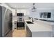 Kitchen featuring stainless steel appliances, quartz countertops, and an undermount sink at 4103 Gulf Blvd # 107, St Pete Beach, FL 33706