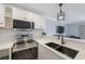 Kitchen featuring stainless steel appliances, quartz countertops, and an undermount sink at 4103 Gulf Blvd # 107, St Pete Beach, FL 33706