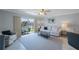 Bright living room boasts sliding glass doors to balcony and views of the water and boats at 4103 Gulf Blvd # 107, St Pete Beach, FL 33706