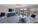 Living room view to the balcony that overlooks the water at 4103 Gulf Blvd # 107, St Pete Beach, FL 33706
