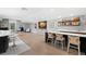 Spacious basement featuring hardwood floors, a bar with seating, and a tv at 419 S Shore Crest Dr, Tampa, FL 33609