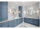 Stylish bathroom with dual vanities, marble floors, and ample storage at 419 S Shore Crest Dr, Tampa, FL 33609