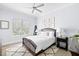 Bedroom with neutral color scheme, ceiling fan, and natural lighting at 419 S Shore Crest Dr, Tampa, FL 33609