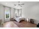 This bedroom features hardwood floors, two windows, and neutral decor at 419 S Shore Crest Dr, Tampa, FL 33609