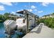 Boat on a lift, showcasing waterfront property access and boating convenience at 419 S Shore Crest Dr, Tampa, FL 33609