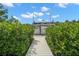Walkway to a boat lift, set amidst lush greenery, leading to waterfront fun and convenience at 419 S Shore Crest Dr, Tampa, FL 33609