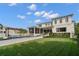 Expansive home exterior with a pool, outdoor seating, lush lawn and screened-in porch at 419 S Shore Crest Dr, Tampa, FL 33609